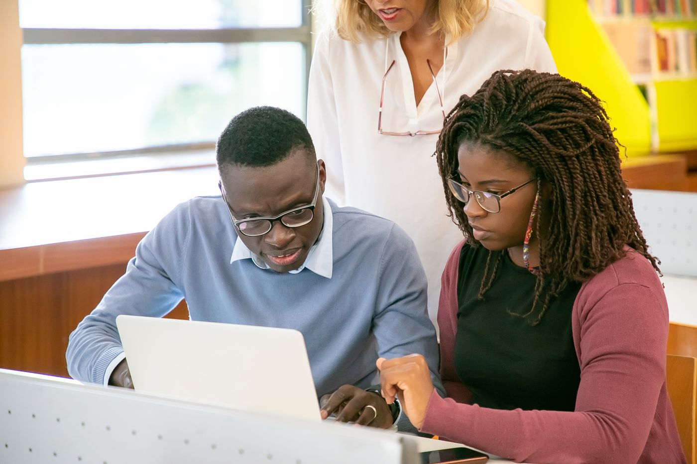 Adults working together in a learning environment